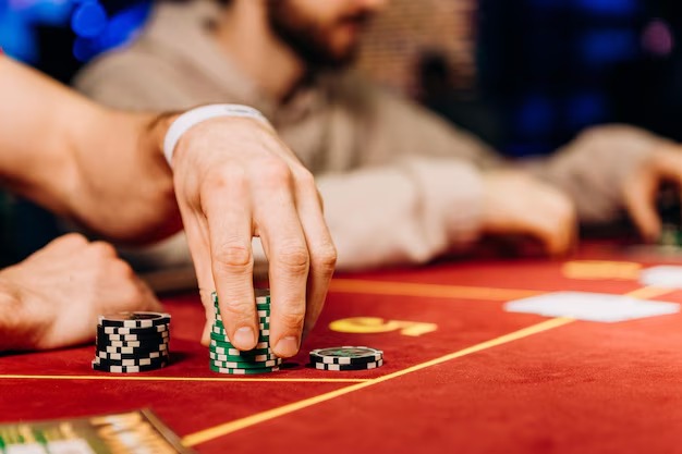 professional live dealer managing Bandar Poker table with cards and chips
